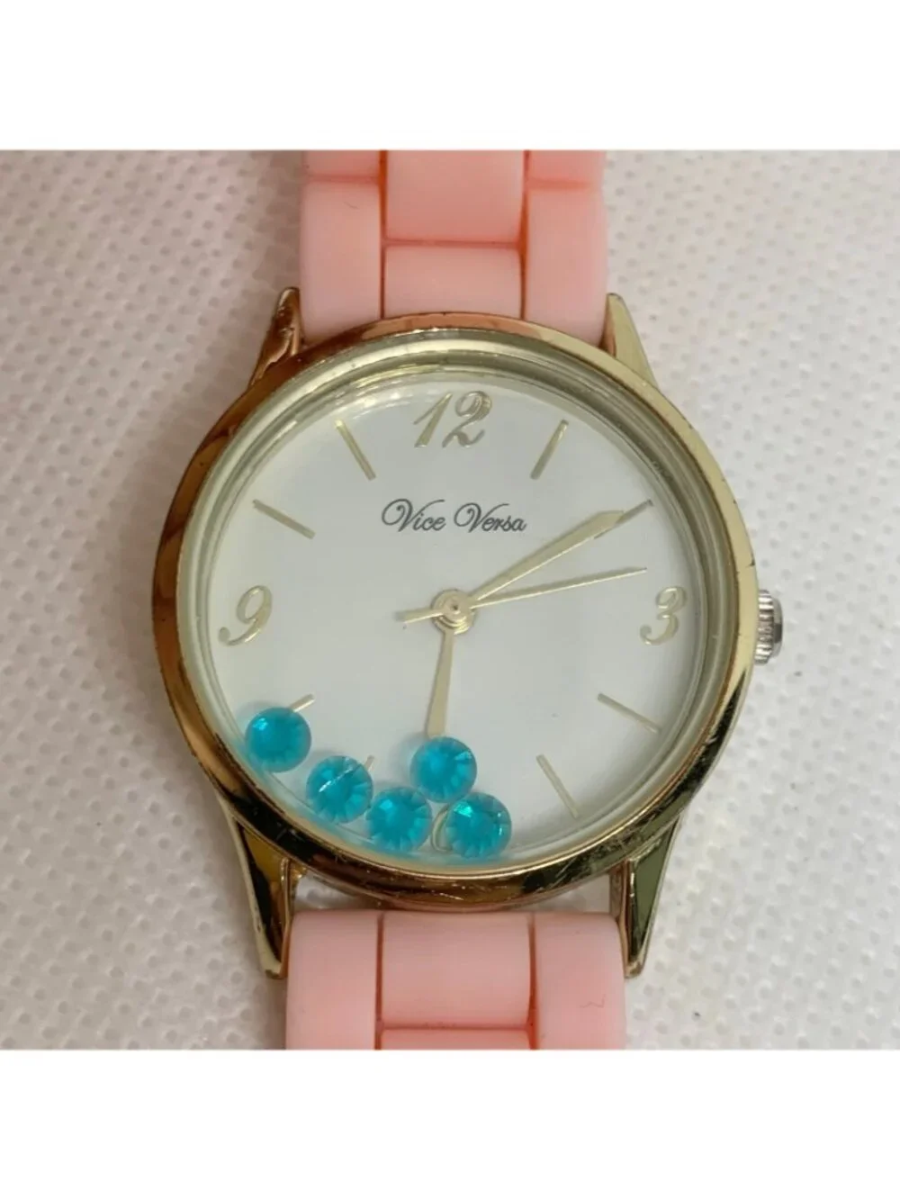 Vice Versa women Floating blue Stones Watch gold toned 30mm quartz pink running